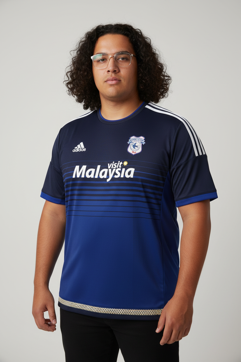 Cardiff City shirt on model with curly hair and glasses